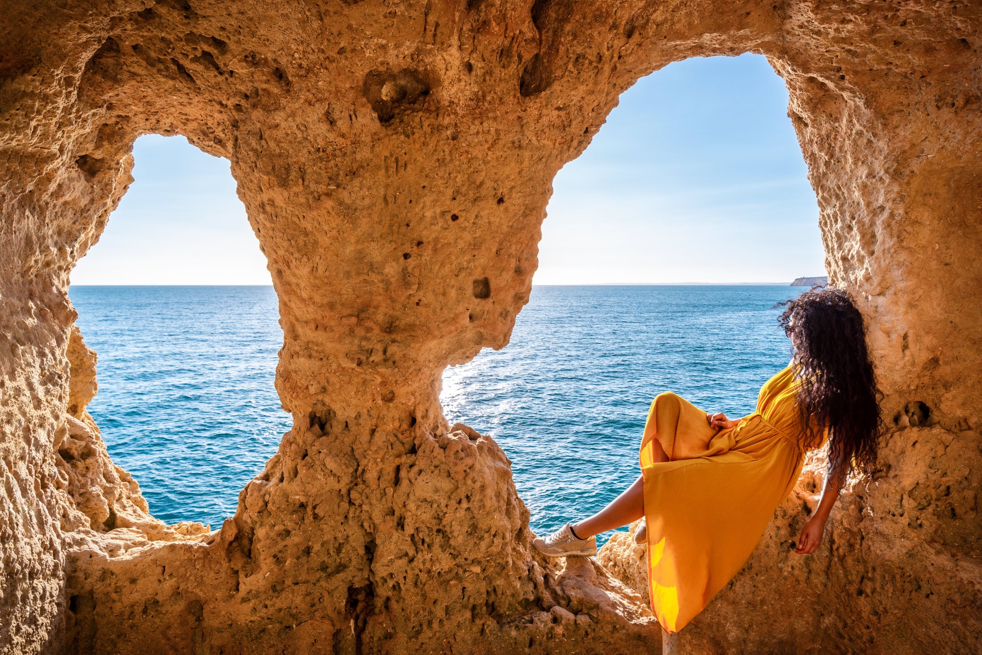 Woman Enjoying Ocean View from Algar Seco Boneca  Cave, Carvoeiro, Algarve, Portugal